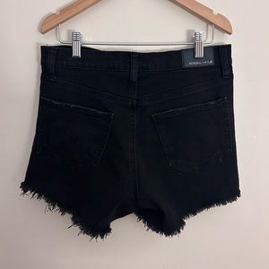 black ripped jean shorts